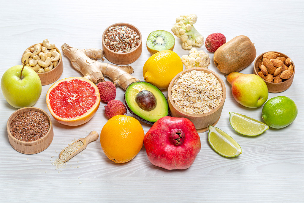 A selection of healthy foods, including fruits and nuts